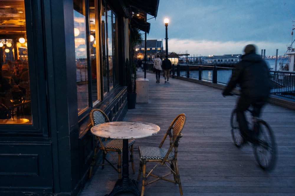 Seaport district restaurants with harbor view at dusk