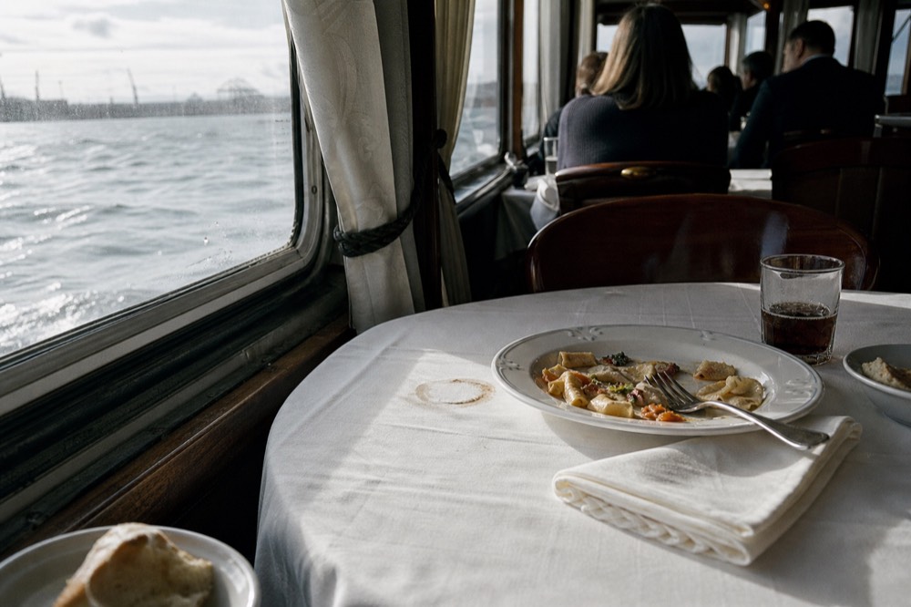 Odyssey dinner cruise plated meal and white tablecloth
