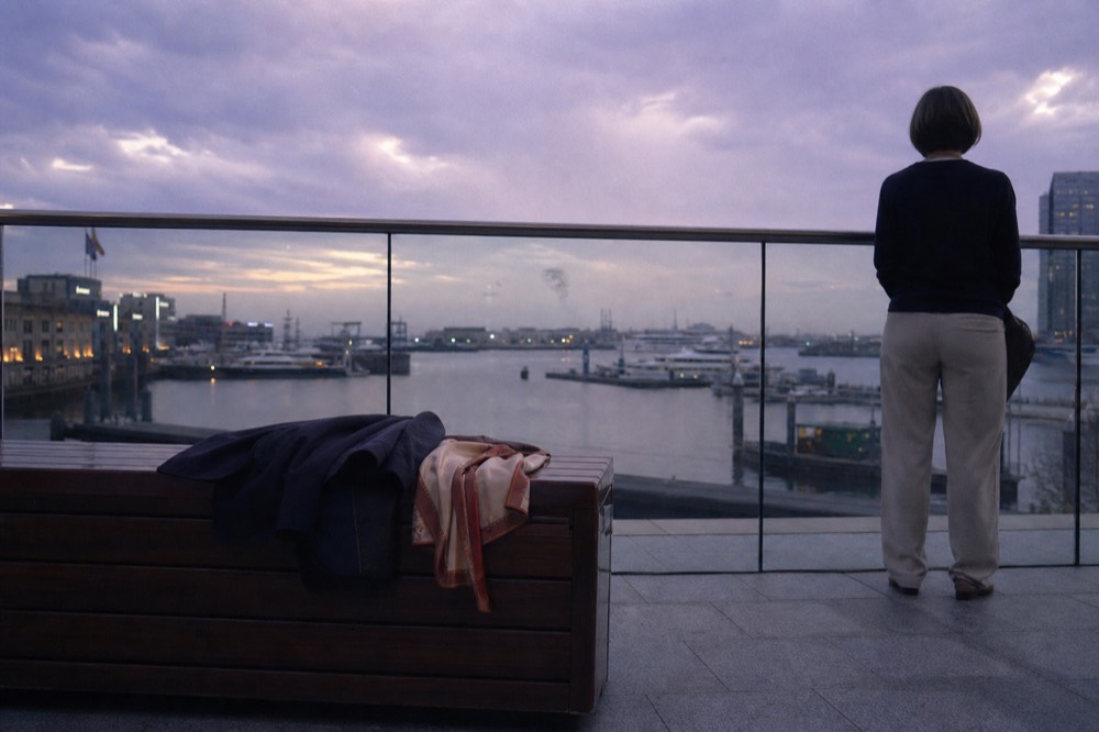Smart casual outfits on a dinner cruise observation deck at dusk