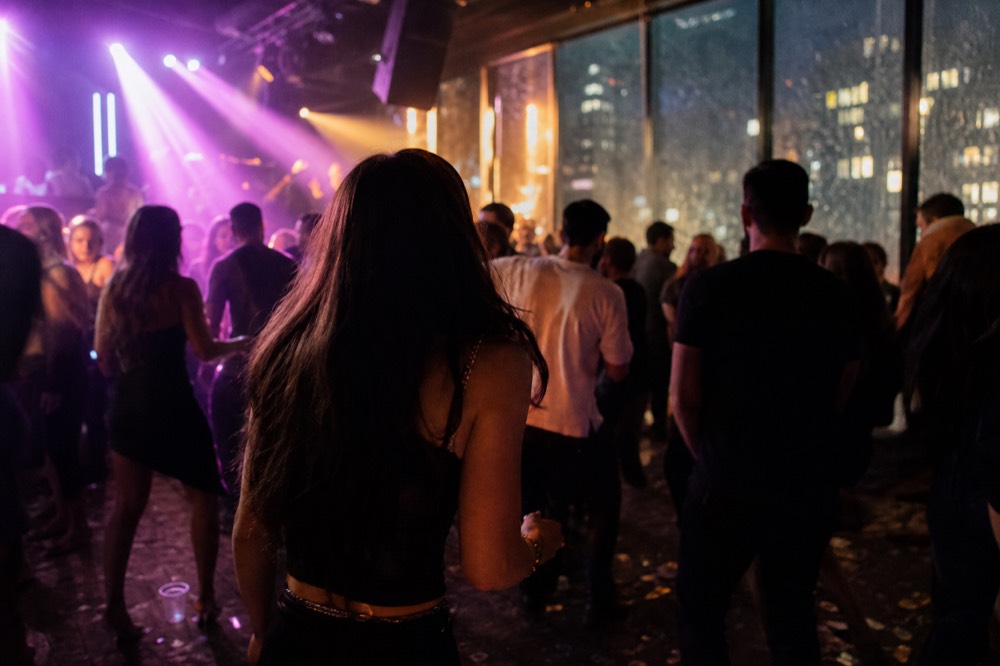 Spirit of Boston dinner cruise dance floor with DJ and city lights