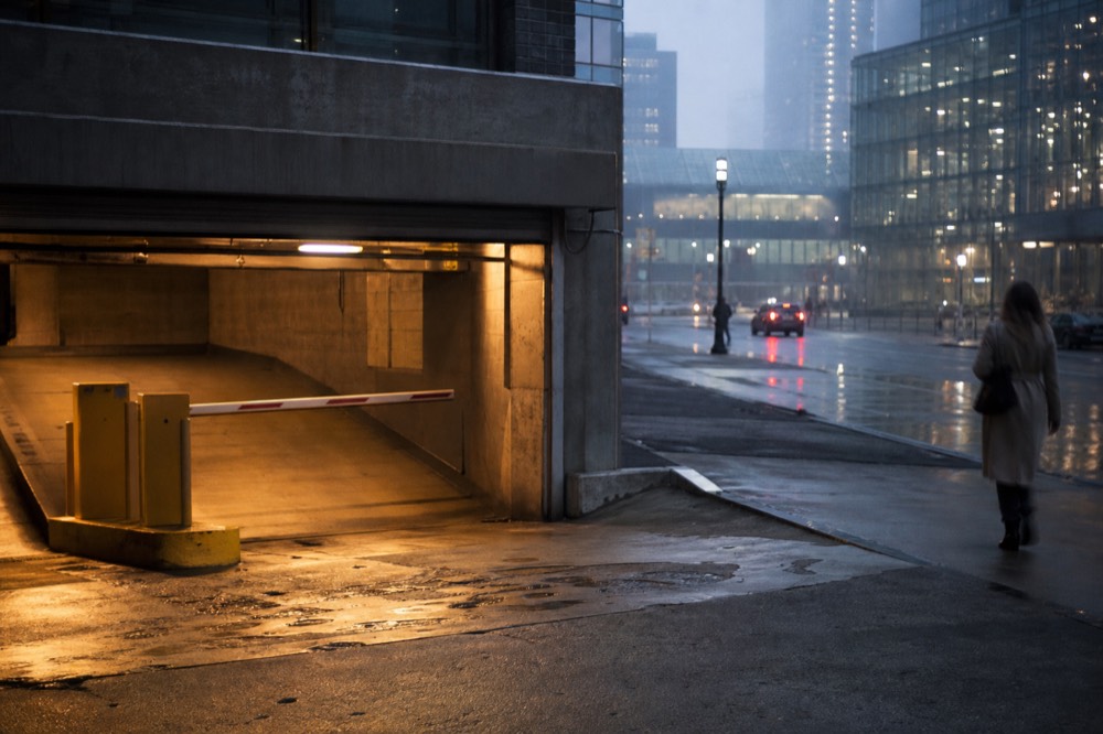 A parking garage entrance in the Boston Seaport district in the early evening